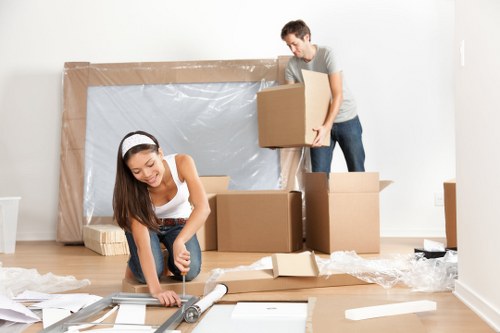 Moving team handling flat removals in Bromley at a residential block entrance