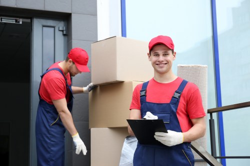 Removal team sorting reusable household items for recycling in Bromley