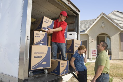 Professional removalists handling furniture in a Bromley residential property