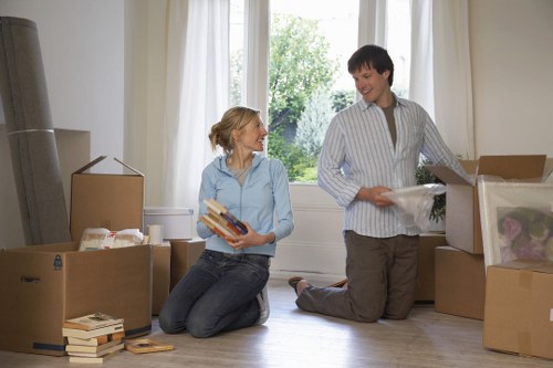 Staff handling furniture with careful lifting techniques