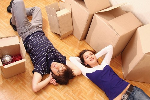 Professional movers handling boxes during a Bromley house move