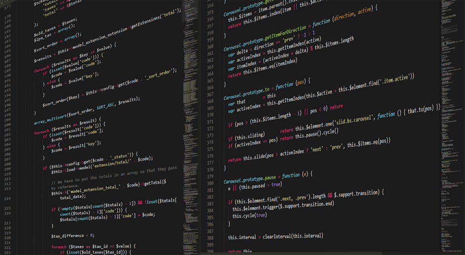 A computer screen displaying lines of HTML code in a dark background, with various tags and syntax highlighted in bright colors such as green, pink, purple, and white. The code includes elements relat